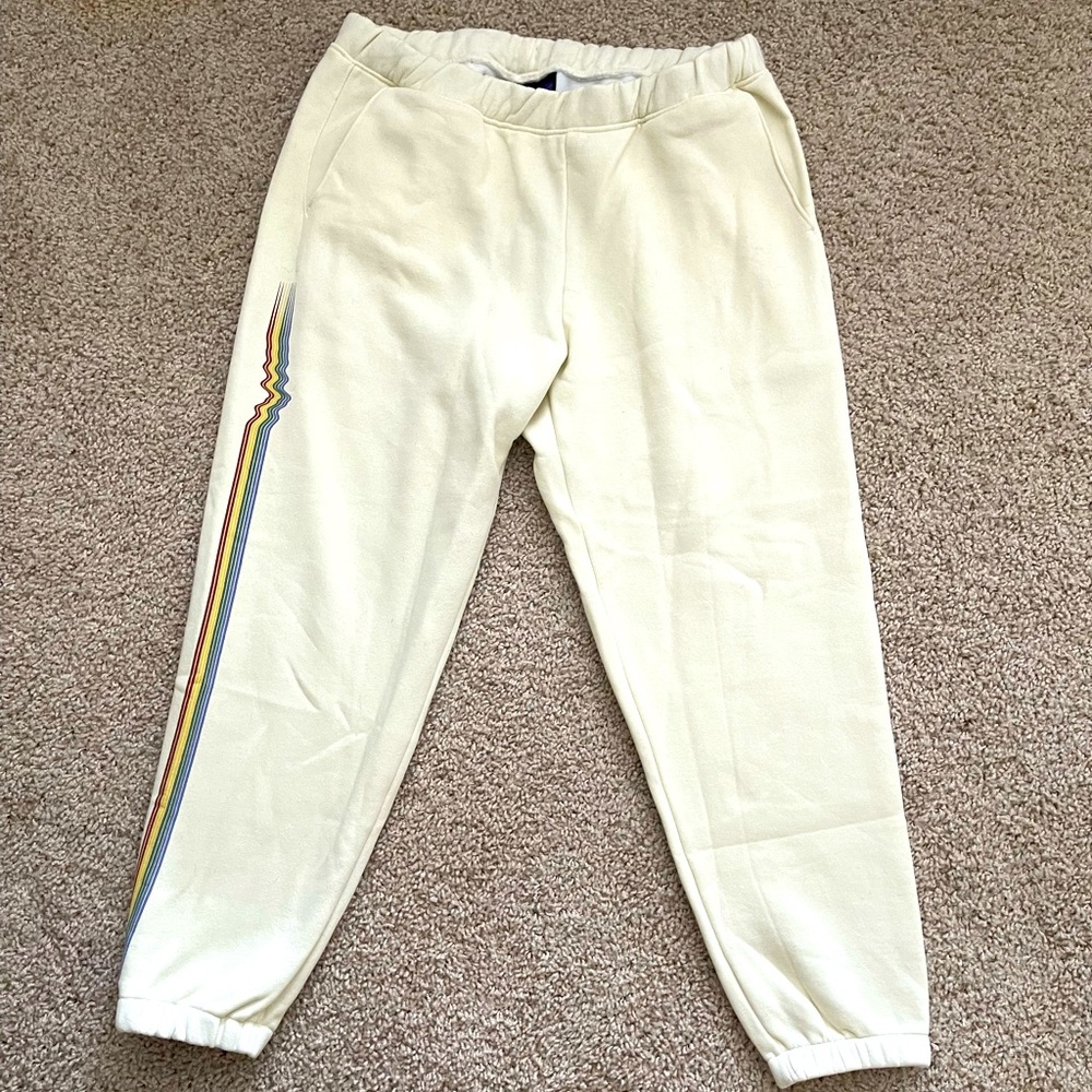 Patagonia women’s sweatpants, cream with rainbow wave on side. Size L, NWT!